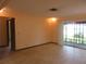 Open living room featuring tile flooring and sliding glass doors leading to an outdoor view at 1675 Se 190Th Ave, Silver Springs, FL 34488
