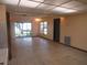 Spacious living room with tile flooring, a sliding glass door, and a view of the outdoors at 1675 Se 190Th Ave, Silver Springs, FL 34488