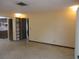 Bright living room featuring tile floors, neutral paint, and doorway to the kitchen at 1675 Se 190Th Ave, Silver Springs, FL 34488