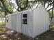 Exterior of a metal storage shed, featuring horizontal lines and a single door at 1675 Se 190Th Ave, Silver Springs, FL 34488