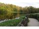 Picturesque waterfront scenery with vibrant trees reflecting off the serene waters, creating a peaceful outdoor setting at 1675 Se 190Th Ave, Silver Springs, FL 34488