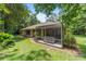 Expansive backyard features a screened porch with a hot tub, perfect for relaxation and entertaining at 18328 Sw 73Rd Loop, Dunnellon, FL 34432
