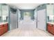 Well-lit bathroom with a soaking tub, separate shower, and dual vanities at 18328 Sw 73Rd Loop, Dunnellon, FL 34432