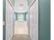 Bright bathroom with tile flooring, dual closets, and natural light at 18328 Sw 73Rd Loop, Dunnellon, FL 34432