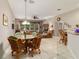 The dining area features tile floors and wicker furniture at 18328 Sw 73Rd Loop, Dunnellon, FL 34432