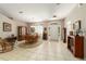 Open-concept dining area adjacent to the front entry with tile flooring and chandelier at 18328 Sw 73Rd Loop, Dunnellon, FL 34432