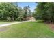 Spacious landscaped front yard and a charming single-story home with a three car garage at 18328 Sw 73Rd Loop, Dunnellon, FL 34432