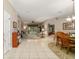 Open-concept living and dining area with tile floors and lots of natural light at 18328 Sw 73Rd Loop, Dunnellon, FL 34432