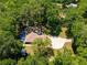 Aerial view of the property highlighting its lush landscaping and private pool at 200 Se 145Th St, Summerfield, FL 34491