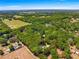 Aerial view showing the home's secluded, wooded location at 200 Se 145Th St, Summerfield, FL 34491