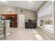Bright breakfast nook with large window overlooking the pool, coffee bar and access to the outdoor patio for casual dining at 200 Se 145Th St, Summerfield, FL 34491