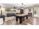Game room with pool table, bar, and lounge area at 200 Se 145Th St, Summerfield, FL 34491