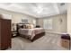 Spacious main bedroom with tray ceiling and coastal decor at 200 Se 145Th St, Summerfield, FL 34491