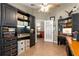 Well-appointed study with custom built-in cabinets and desk space, providing a functional and organized workspace at 200 Se 145Th St, Summerfield, FL 34491