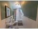 Tiled bathroom featuring a vanity and bath tub at 20549 9Th St, Mc Intosh, FL 32664