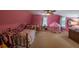 Bright bedroom featuring a cozy bed, play tent, carpeted floor, and windows offering natural light at 20549 9Th St, Mc Intosh, FL 32664