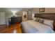 Cozy bedroom with a large bed, wooden dresser, and natural lighting at 20549 9Th St, Mc Intosh, FL 32664