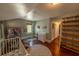 Bedroom featuring a crib, hardwood floors, and plenty of storage space at 20549 9Th St, Mc Intosh, FL 32664