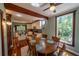 Dining room with hardwood floors and is open to the updated kitchen with white cabinets at 20549 9Th St, Mc Intosh, FL 32664