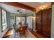 Cozy dining room featuring hardwood floors, a round wooden table, and a ceiling fan at 20549 9Th St, Mc Intosh, FL 32664