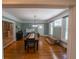 Spacious dining room with fireplace, hardwood floors, and natural light at 20549 9Th St, Mc Intosh, FL 32664