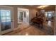 Tile entryway with a piano and views to stairs and a half-bathroom at 20549 9Th St, Mc Intosh, FL 32664