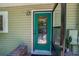 Close-up of the front door with a glass pane and sidelight at 20549 9Th St, Mc Intosh, FL 32664