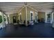 Expansive front porch with room for seating, dining, and enjoying the outdoor ambiance at 20549 9Th St, Mc Intosh, FL 32664