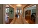 Hallway with hardwood floors, decorative tile, and neutral paint at 20549 9Th St, Mc Intosh, FL 32664