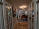 Hallway with tile floor and a grand piano at 20549 9Th St, Mc Intosh, FL 32664