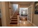 View of the stairwell and front room from the hall at 20549 9Th St, Mc Intosh, FL 32664