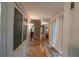 Bright hallway with tile flooring, a window seat, and access to other rooms in the home at 20549 9Th St, Mc Intosh, FL 32664