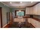 Kitchen featuring an island, stainless steel appliances and fixtures at 20549 9Th St, Mc Intosh, FL 32664