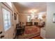 Living room with a brick fireplace, wooden floors, area rug, and stylish furnishings at 20549 9Th St, Mc Intosh, FL 32664