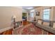 Inviting living room with a comfortable sofa, bookshelf, and decorative rug at 20549 9Th St, Mc Intosh, FL 32664
