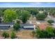 Aerial view of a home with mature trees and a peaceful residential neighborhood at 219 Marion Oaks Ln, Ocala, FL 34473