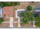 Aerial view of the property showcasing roof, driveway and large shade tree at 219 Marion Oaks Ln, Ocala, FL 34473