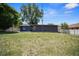 A large backyard with lawn space and fence provides privacy for outdoor enjoyment and home expansion at 219 Marion Oaks Ln, Ocala, FL 34473