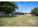 Spacious backyard with chain link and privacy fences and patio area at 219 Marion Oaks Ln, Ocala, FL 34473
