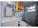 Bathroom with blue tiled walls, modern fixtures, vanity, and a shower at 219 Marion Oaks Ln, Ocala, FL 34473