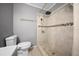 Updated bathroom features a tiled walk-in shower with a shower head at 219 Marion Oaks Ln, Ocala, FL 34473