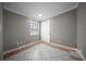 An empty room with modern flooring, neutral walls, and a large window for natural light at 219 Marion Oaks Ln, Ocala, FL 34473