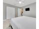 Comfortable bedroom featuring tile flooring, closet, and a ceiling fan at 219 Marion Oaks Ln, Ocala, FL 34473