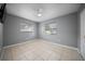 A bedroom featuring tile flooring, neutral paint, ceiling fan, and natural lighting at 219 Marion Oaks Ln, Ocala, FL 34473