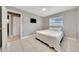 Cozy bedroom with tile flooring and a neutral color scheme at 219 Marion Oaks Ln, Ocala, FL 34473