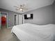 Comfortable bedroom featuring neutral walls, tile floors, and natural light at 219 Marion Oaks Ln, Ocala, FL 34473