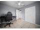 Bedroom featuring gray walls, tile floors, ceiling fan, and closet at 219 Marion Oaks Ln, Ocala, FL 34473
