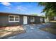 Charming home with a walkway to the front door, fresh landscaping, and a newly painted gray exterior at 219 Marion Oaks Ln, Ocala, FL 34473