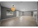 Cozy living room with modern lighting, a ceiling fan, and wood-look floors at 219 Marion Oaks Ln, Ocala, FL 34473