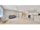 Bright living room featuring updated kitchen, seating, and a ceiling fan at 219 Marion Oaks Ln, Ocala, FL 34473